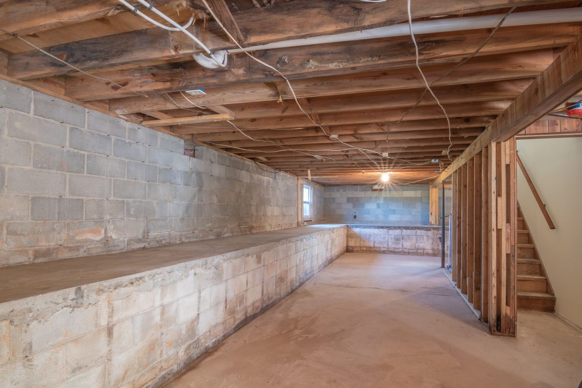 Standing water in a room being assessed for water damage restoration